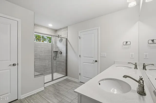 a bathroom with a sink and shower