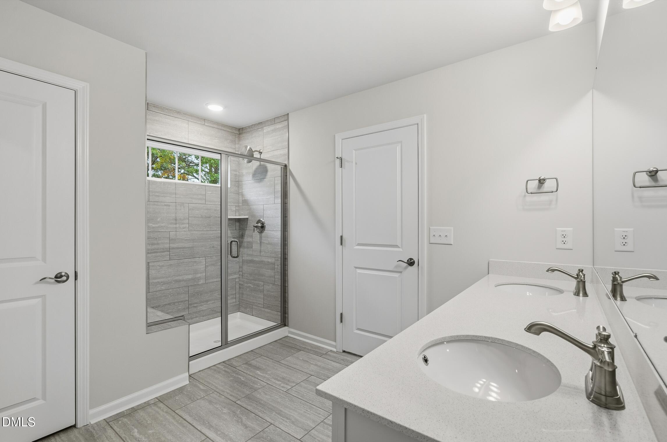 505 Providence Springs Lane Fuquay-Varina, NC 27526 - Photo 32 of 40 a bathroom with a sink and shower