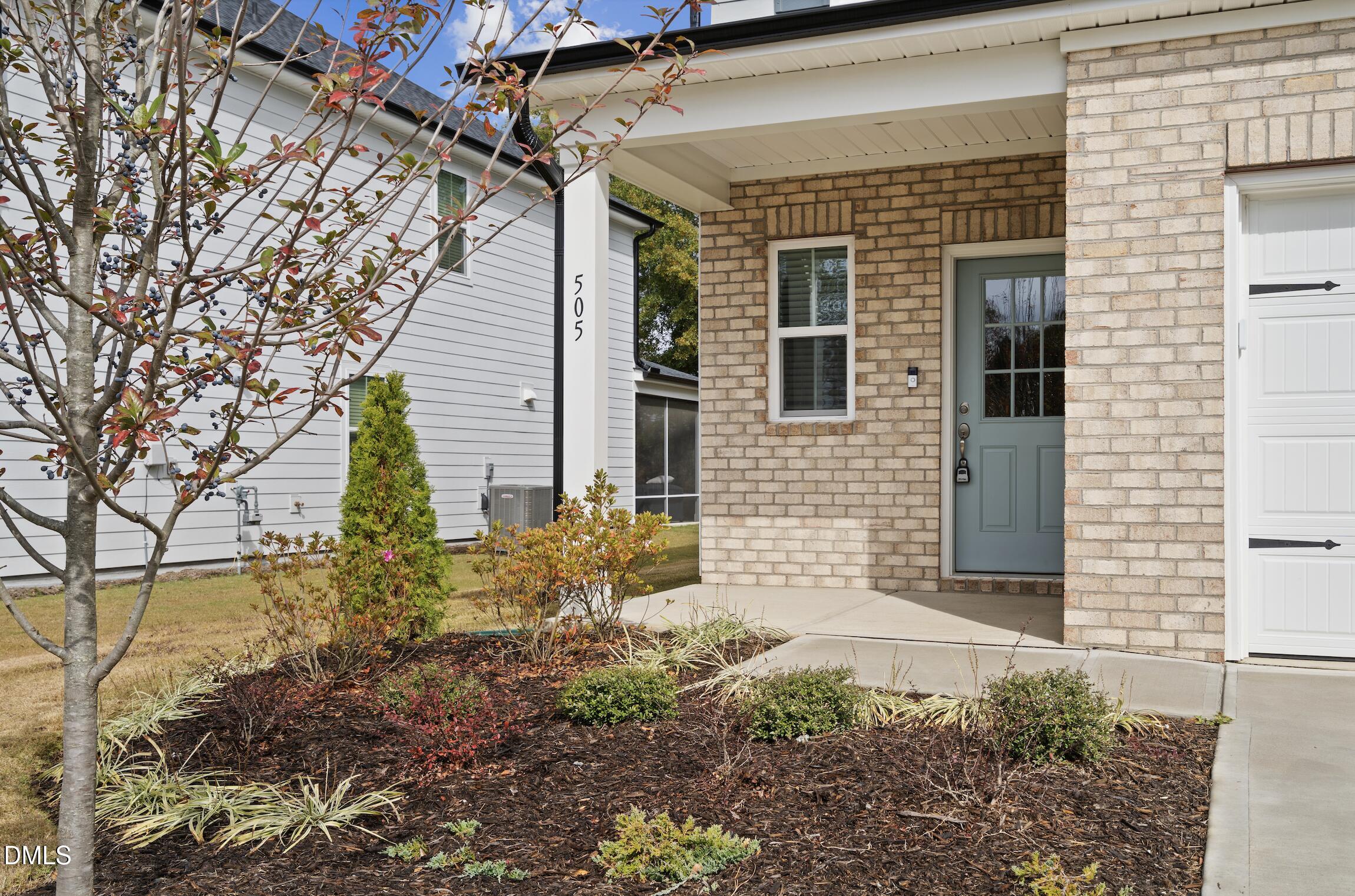 505 Providence Springs Lane Fuquay-Varina, NC 27526 - Photo 4 of 40 a front view of a house with garden