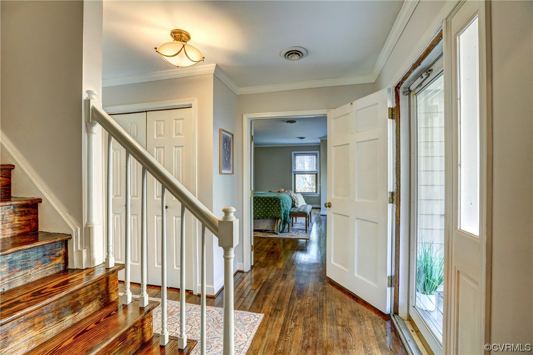 3612 Stoney Ridge Trail Midlothian, VA 23112 - Photo 4 of 49 a view of a hallway with wooden floor and staircase
