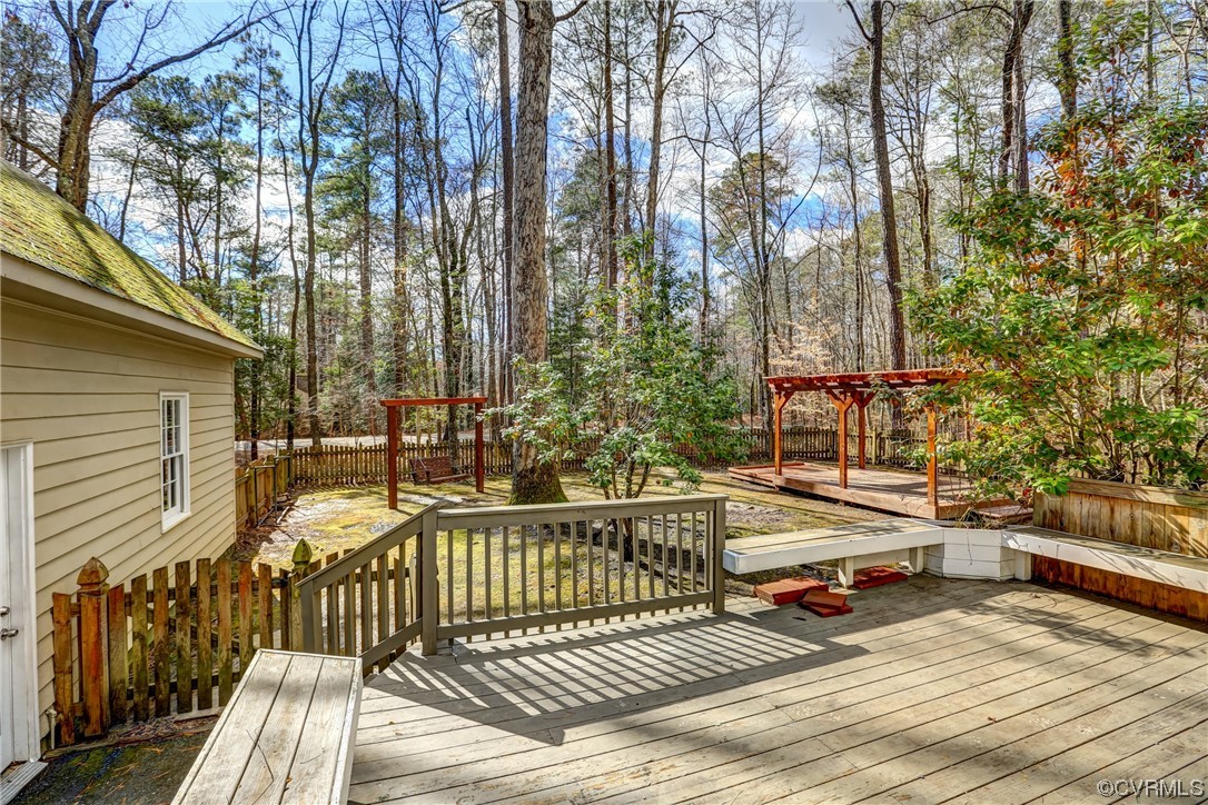 3612 Stoney Ridge Trail Midlothian, VA 23112 - Photo 44 of 49 a view of a roof deck with wooden floor and fence