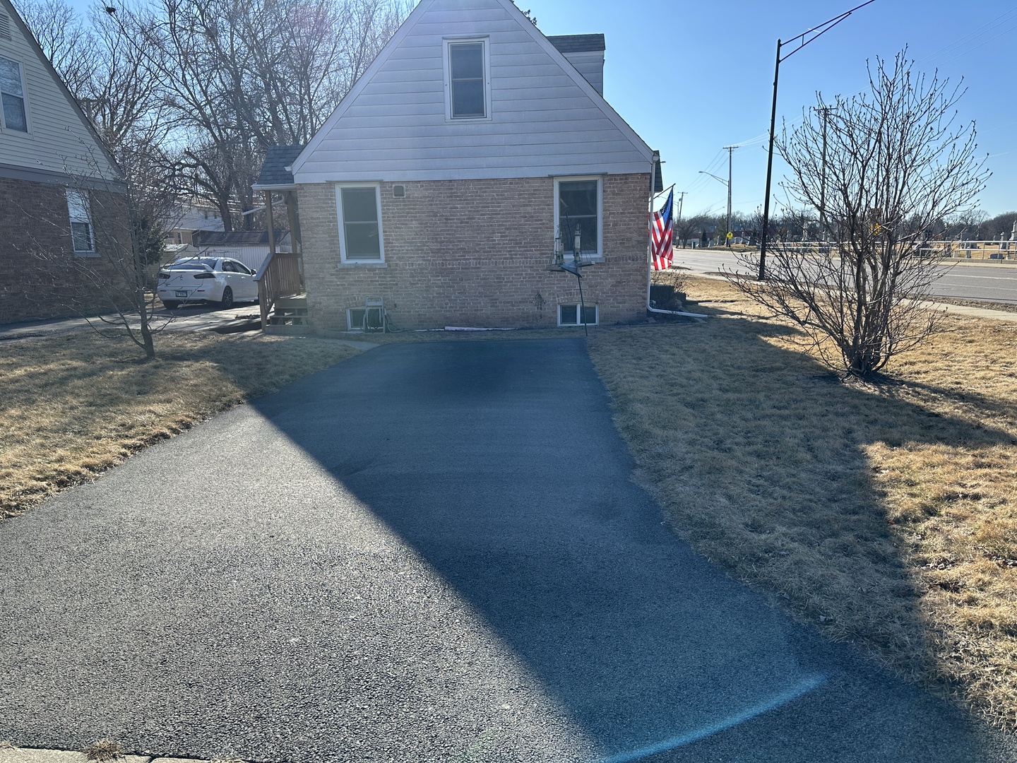 542 Sycamore Road DeKalb, IL 60115 - Photo 17 of 17 a front view of a house with a yard and garage