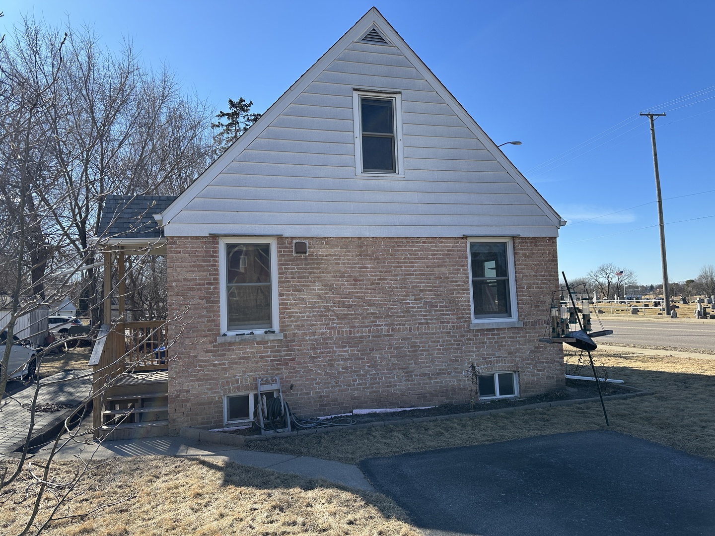 542 Sycamore Road DeKalb, IL 60115 - Photo 3 of 17 a front view of a house with a yard