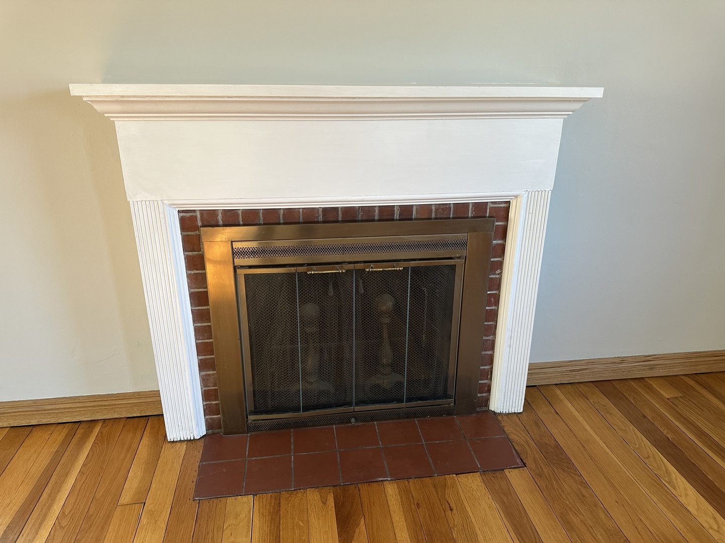 542 Sycamore Road DeKalb, IL 60115 - Photo 6 of 17 a view of a livingroom with wooden floor and a fireplace
