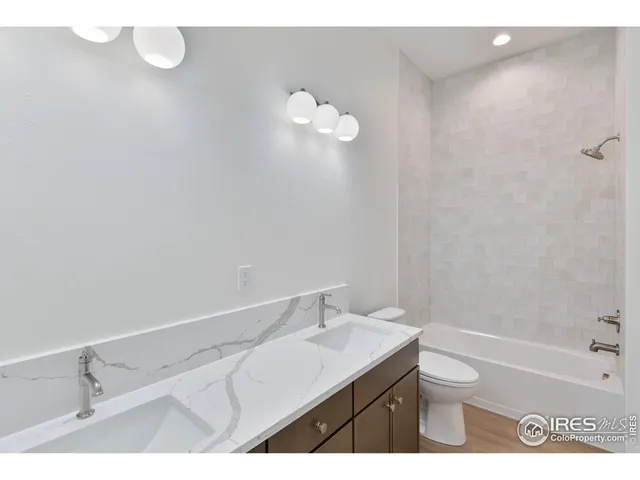 a bathroom with a sink a toilet and bathtub