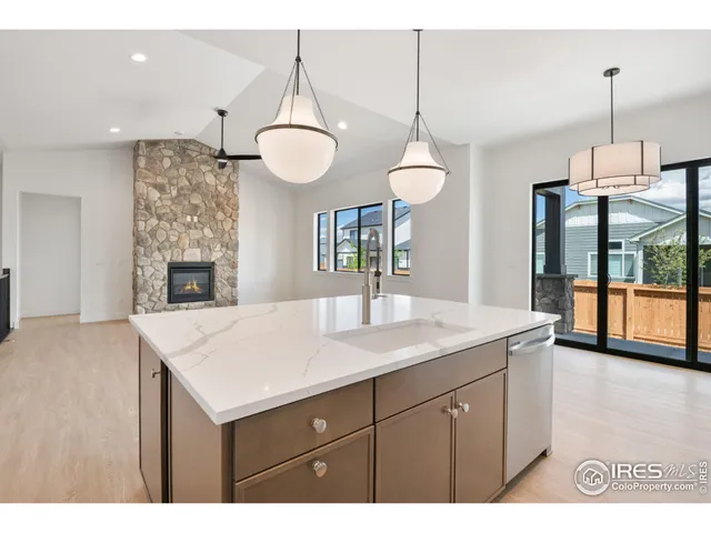 a kitchen with a counter space cabinets and appliances