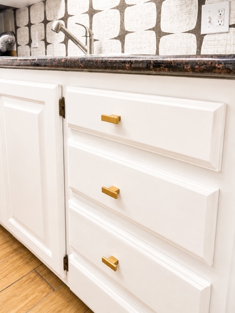 2529 Rio Grande Street, Unit 78 Austin, TX 78705 - Photo 6 of 14 A clean, functional utility sink area with ample cabinet and drawer storage.