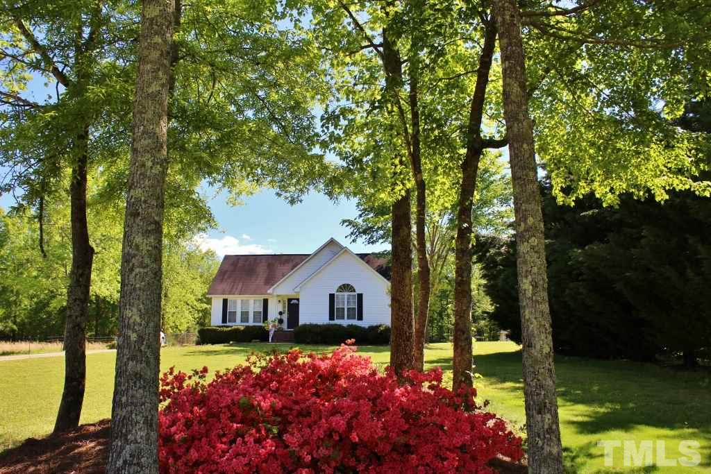 9861 Old Middlesex Road Middlesex, NC 27557 - Photo 1 of 10 a front view of a house with a yard and large trees