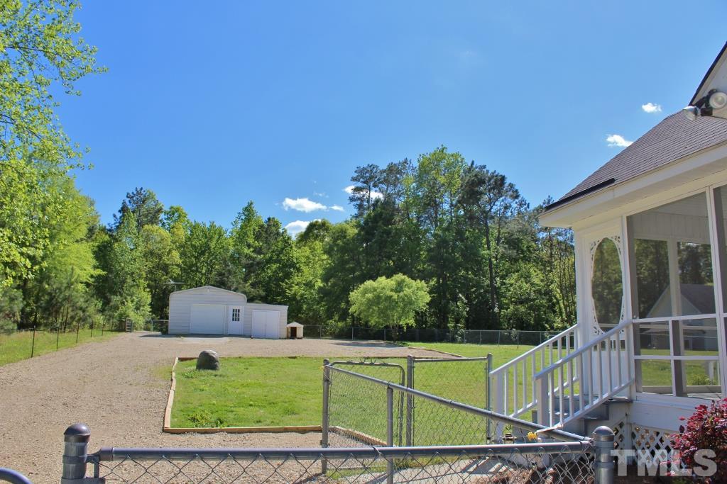 9861 Old Middlesex Road Middlesex, NC 27557 - Photo 3 of 10 a front view of a house with garden
