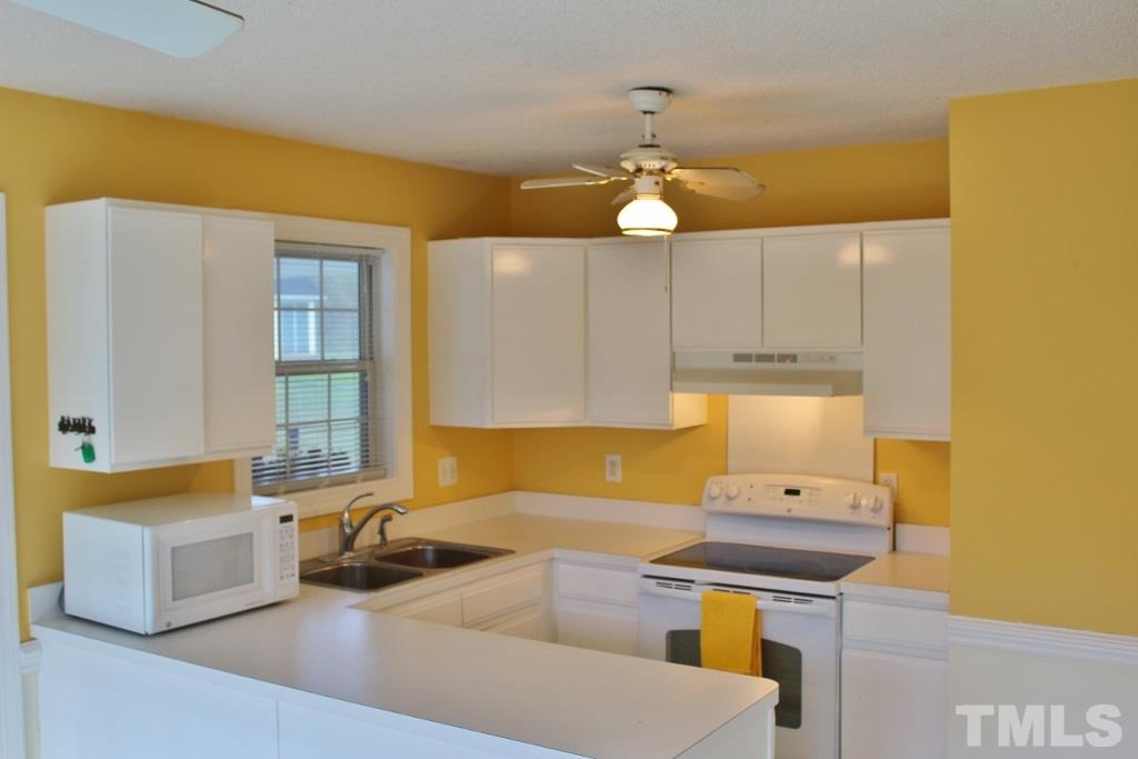 9861 Old Middlesex Road Middlesex, NC 27557 - Photo 5 of 10 a kitchen with a sink appliances and cabinets
