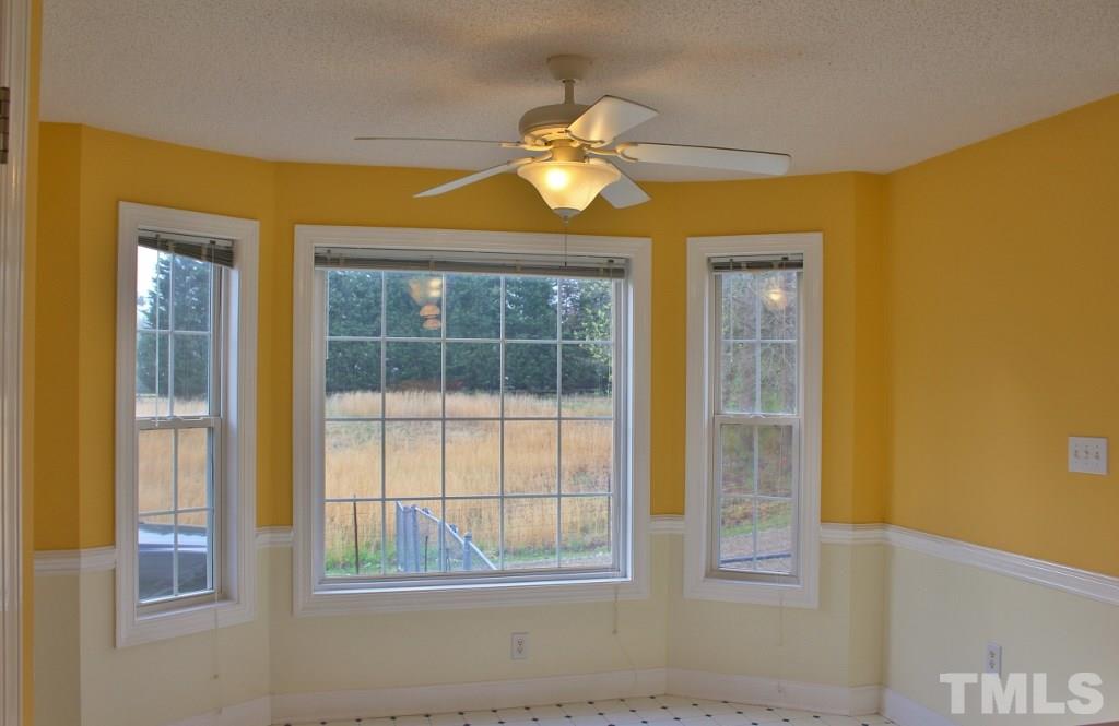 9861 Old Middlesex Road Middlesex, NC 27557 - Photo 6 of 10 a view of a kitchen with a window and a ceiling fan