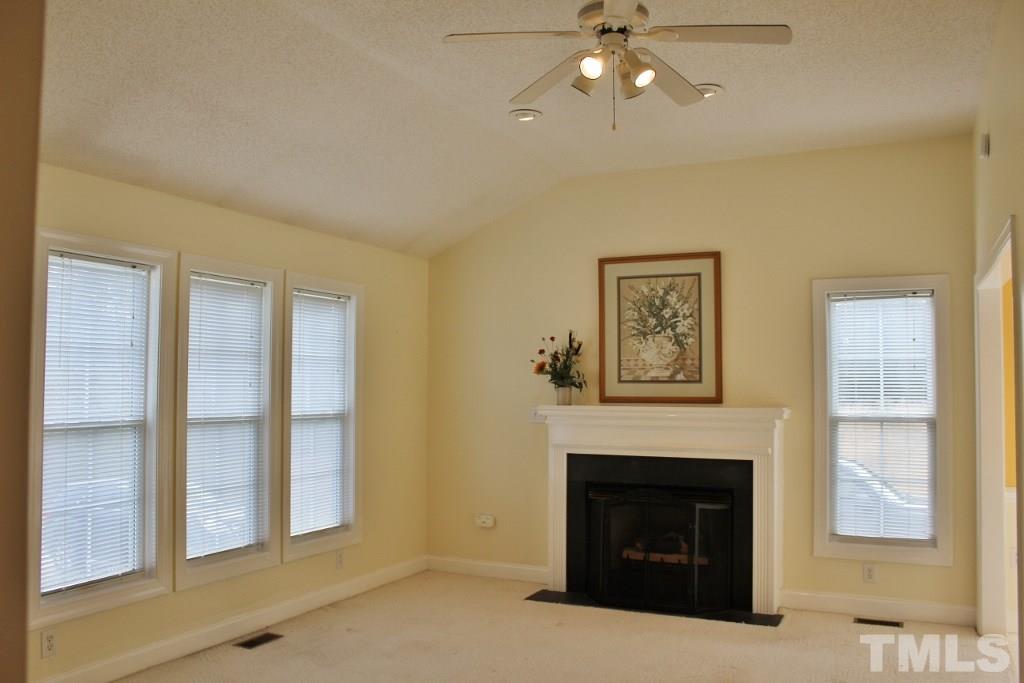 9861 Old Middlesex Road Middlesex, NC 27557 - Photo 7 of 10 a living room with furniture and a fireplace