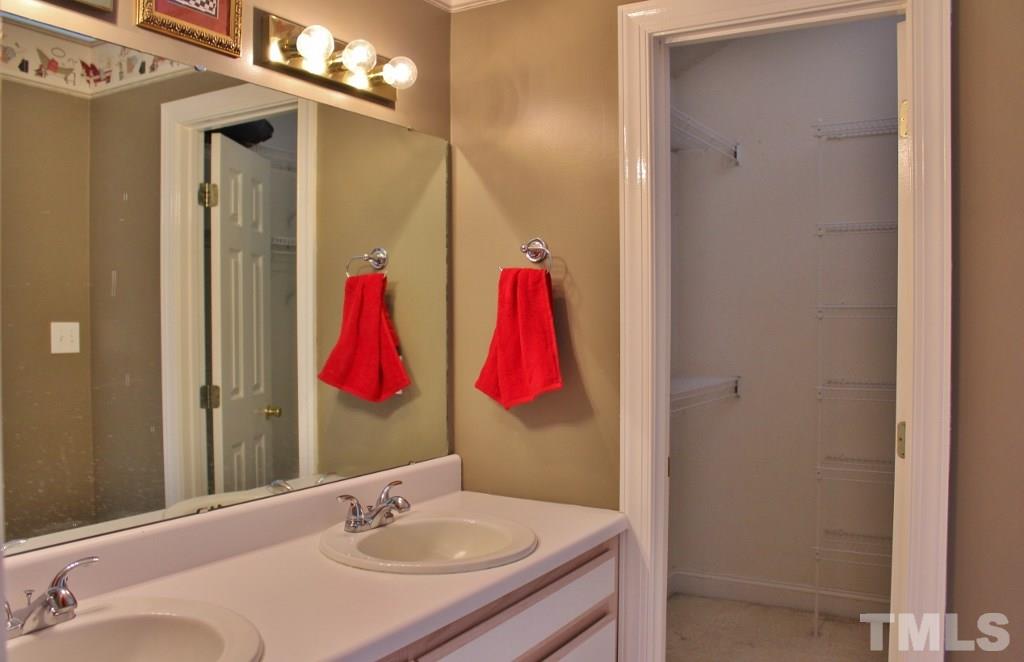 9861 Old Middlesex Road Middlesex, NC 27557 - Photo 8 of 10 a bathroom with a sink vanity and mirror