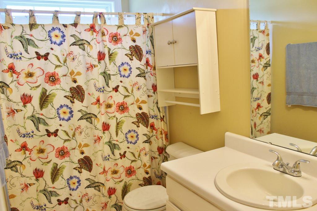 9861 Old Middlesex Road Middlesex, NC 27557 - Photo 10 of 10 a bathroom with a sink and a mirror