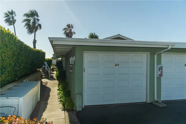 a view of a swimming pool with a patio and a garden