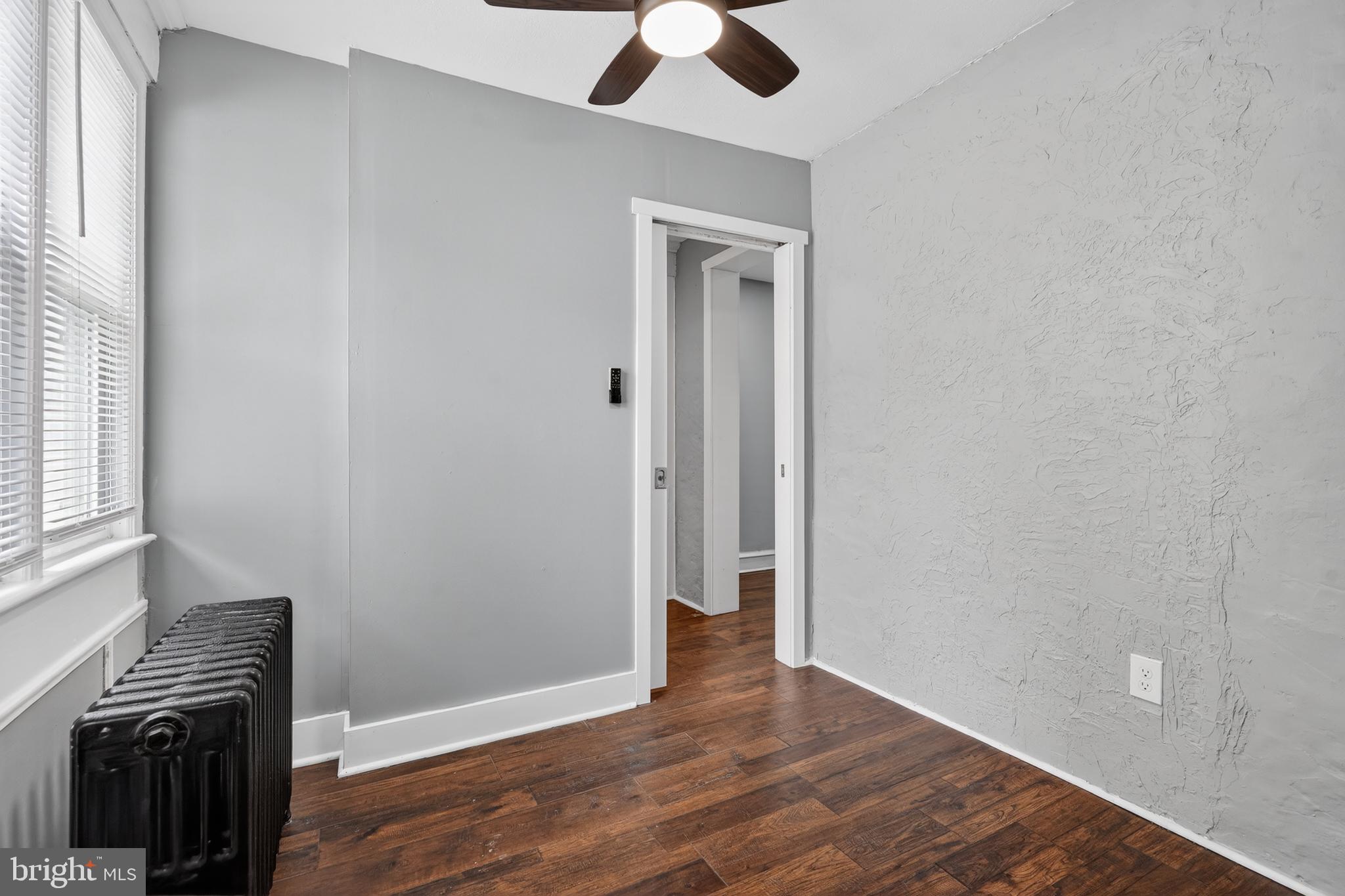 223 Noreg Place Brooklawn, NJ 08030 - Photo 6 of 36 wooden floor in an empty room with a window