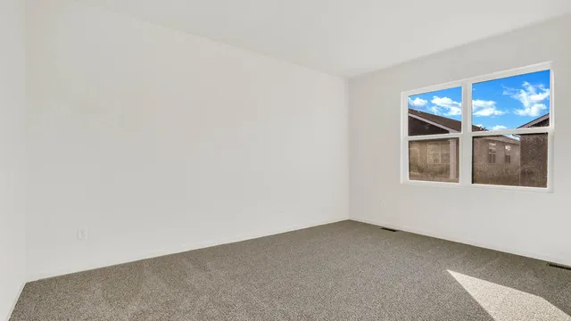 a view of an empty room with windows