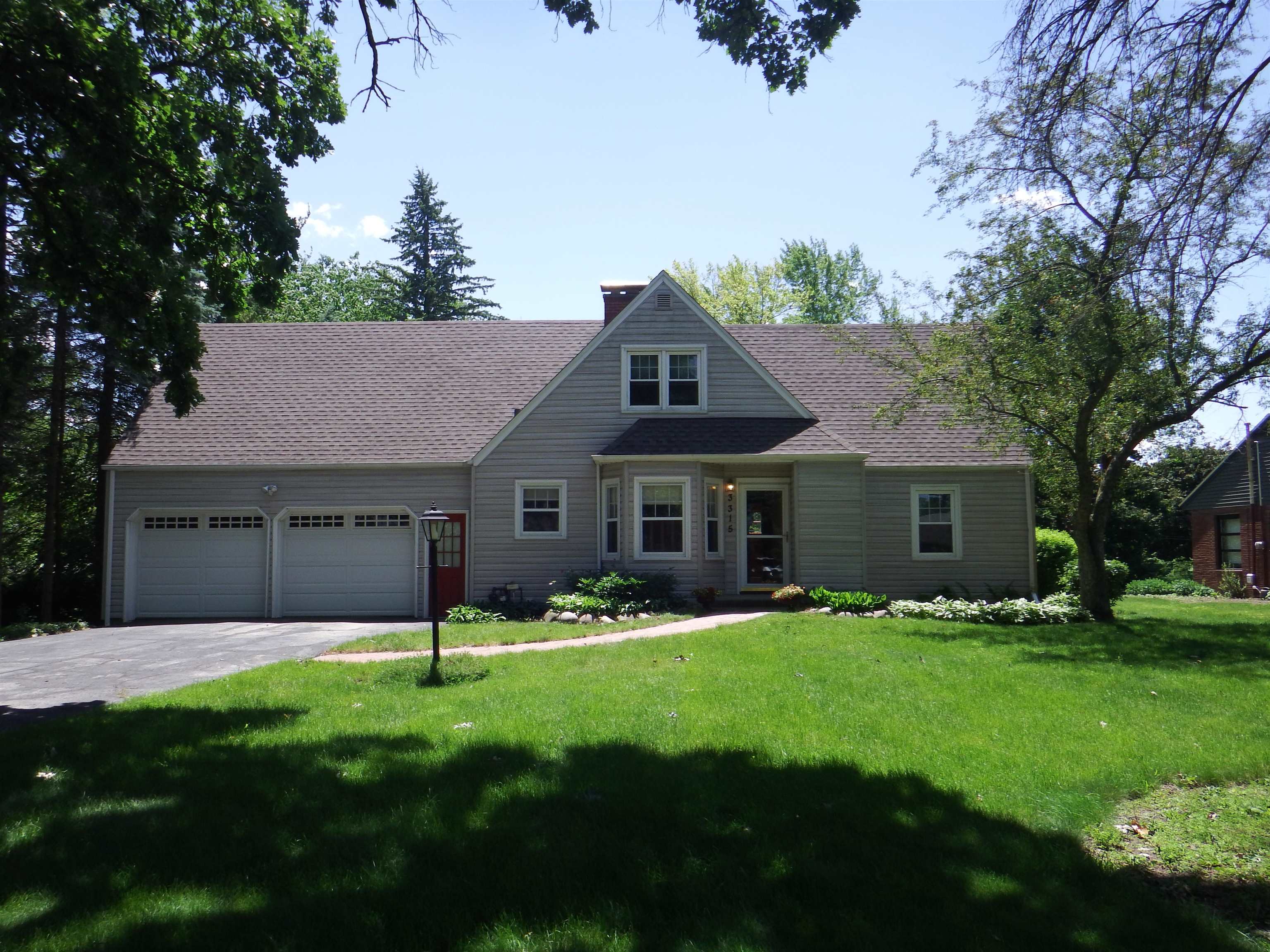 3315 North View Road Rockford, IL 61107 - Photo 1 of 43 a view of a house with a yard potted plants and a large tree