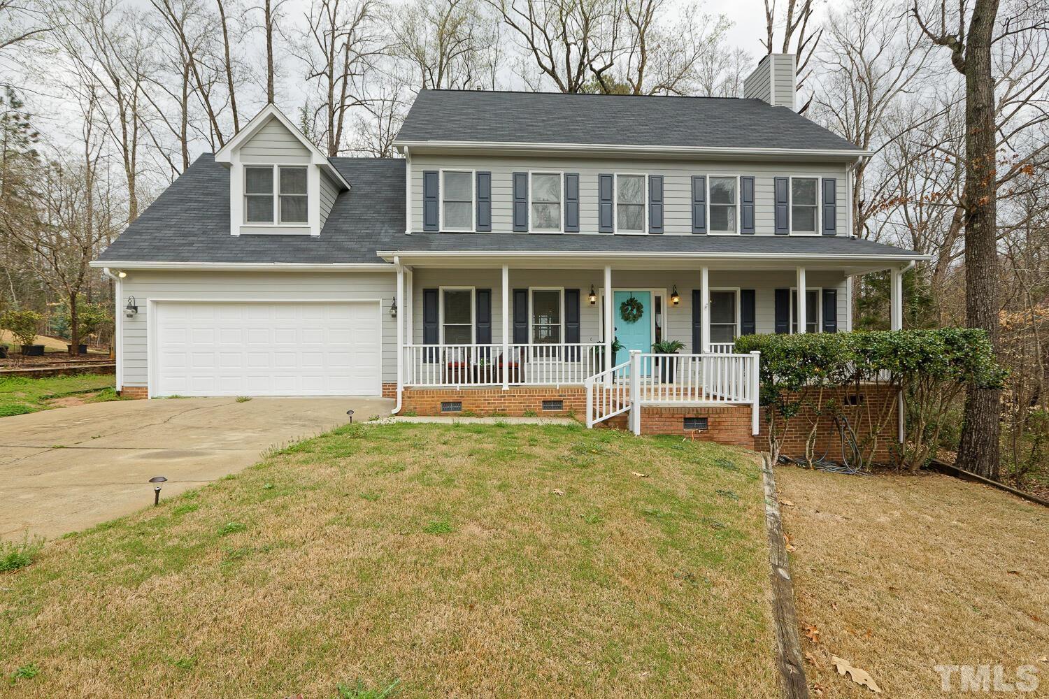 820 Roanoke Drive Cary, NC 27513 - Photo 1 of 43 a front view of a house with a garden