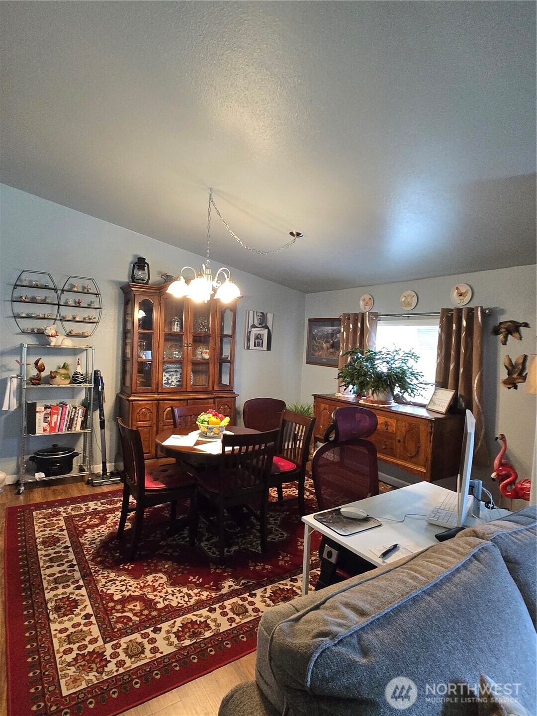 1466 Ferrier Road Winlock, WA 98596 - Photo 8 of 33 a living room with furniture a rug and a flat screen tv