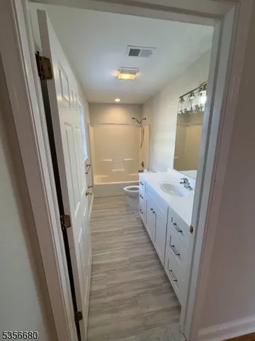 a bathroom with sink and mirror