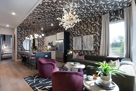 a bedroom with bed and flowerpot