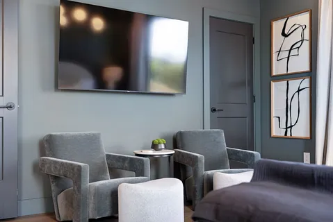 a bathroom with double vanity and a shower