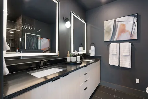 a bathroom with a toilet sink and shower