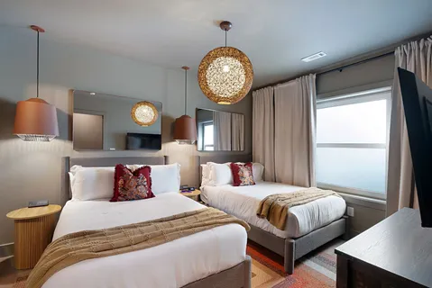 a bedroom with bed and glass door