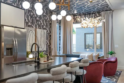 a kitchen with stainless steel appliances a sink stove and cabinets