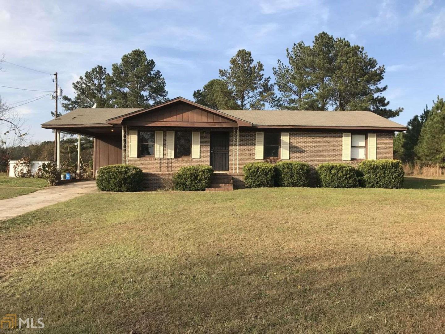 49 Hicks Road Butler, GA 31006 - Photo 1 of 1 a front view of a house with garden