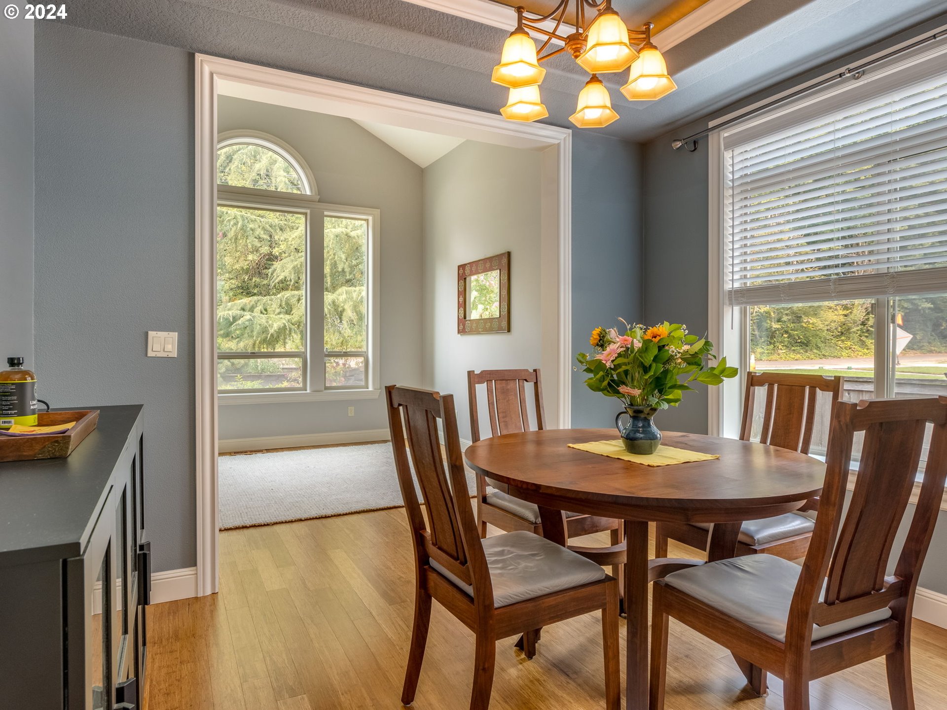 5316 Lower Drive Lake Oswego, OR 97035 - Photo 12 of 25 a view of a dining room with furniture and a chandelier