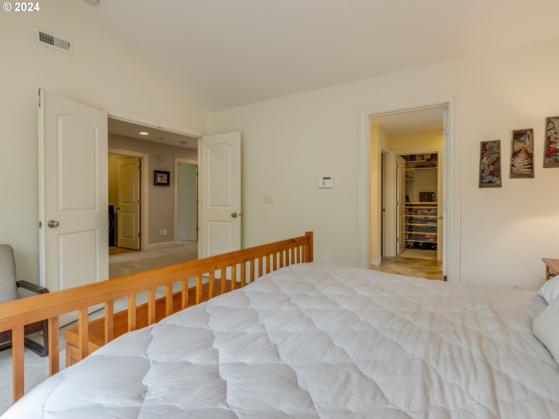 5316 Lower Drive Lake Oswego, OR 97035 - Photo 15 of 25 a view of a bedroom with a large bed and a large mirror