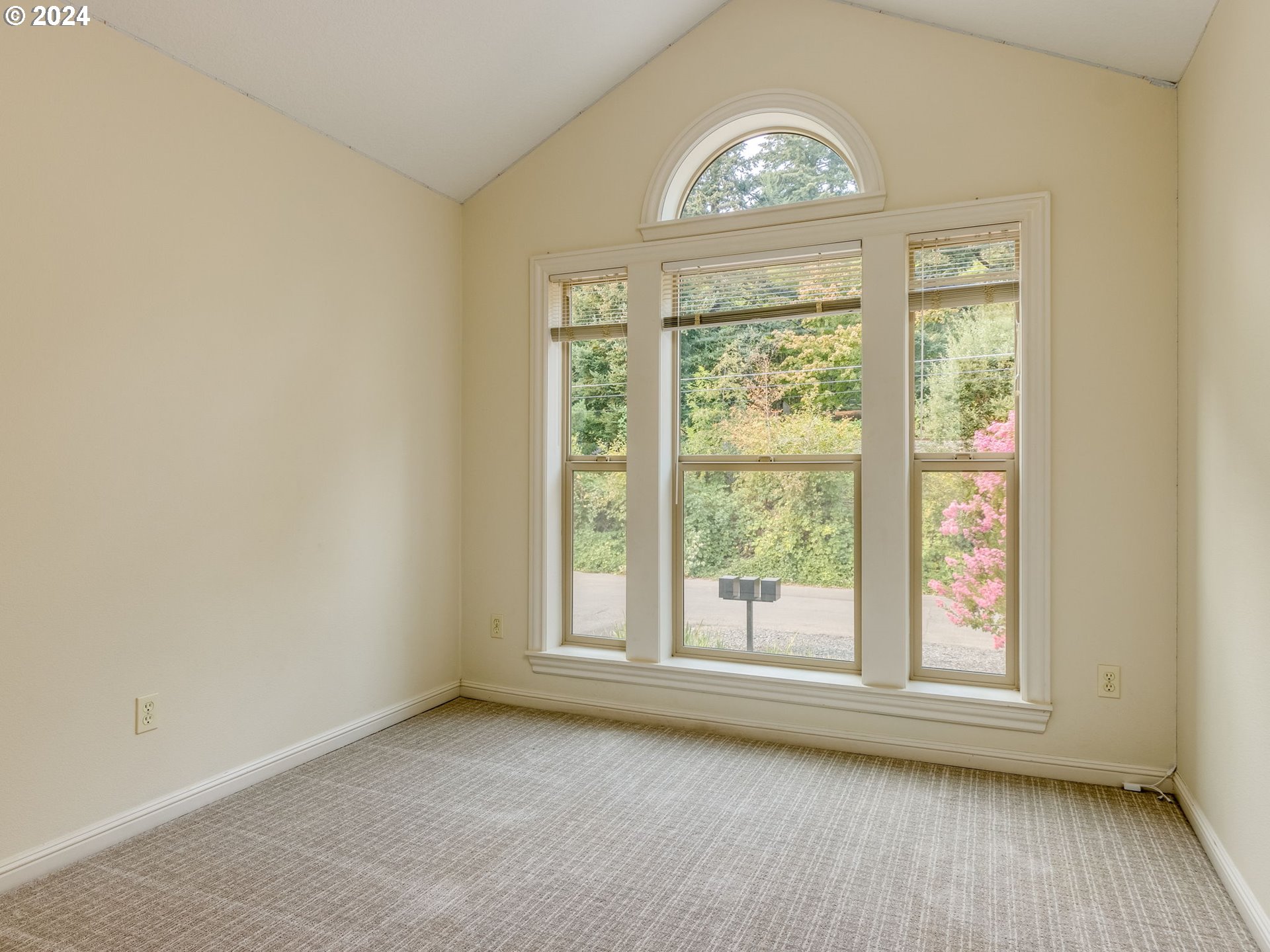 5316 Lower Drive Lake Oswego, OR 97035 - Photo 18 of 25 an empty room with wooden floor a fireplace and windows