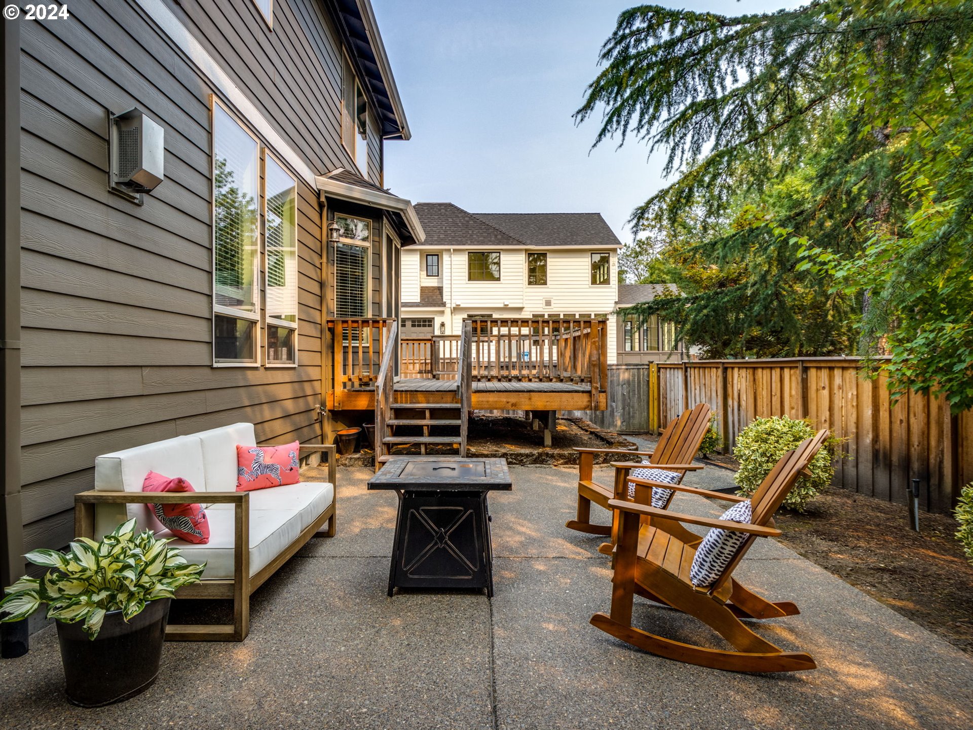 5316 Lower Drive Lake Oswego, OR 97035 - Photo 20 of 25 a view of a chairs and table in the back yard of the house