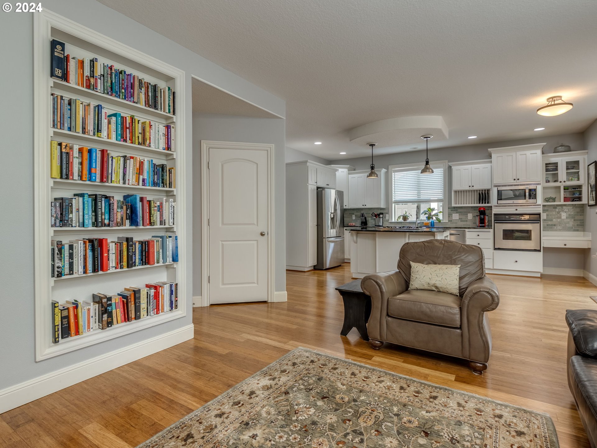 5316 Lower Drive Lake Oswego, OR 97035 - Photo 7 of 25 a living room with furniture and a book shelf