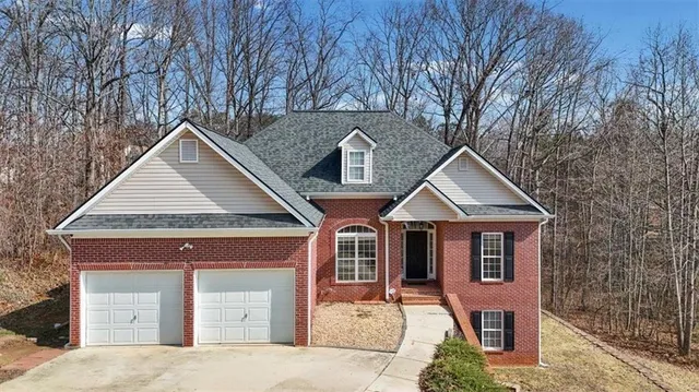 a front view of a house with yard