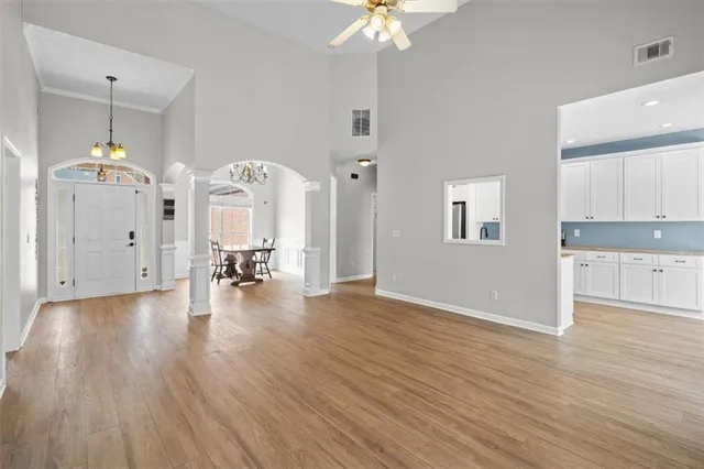 a view of a hallway with wooden floor