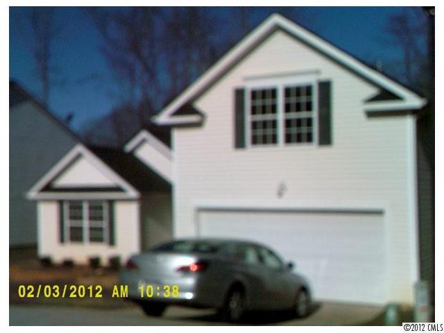 a view of a house with a small yard