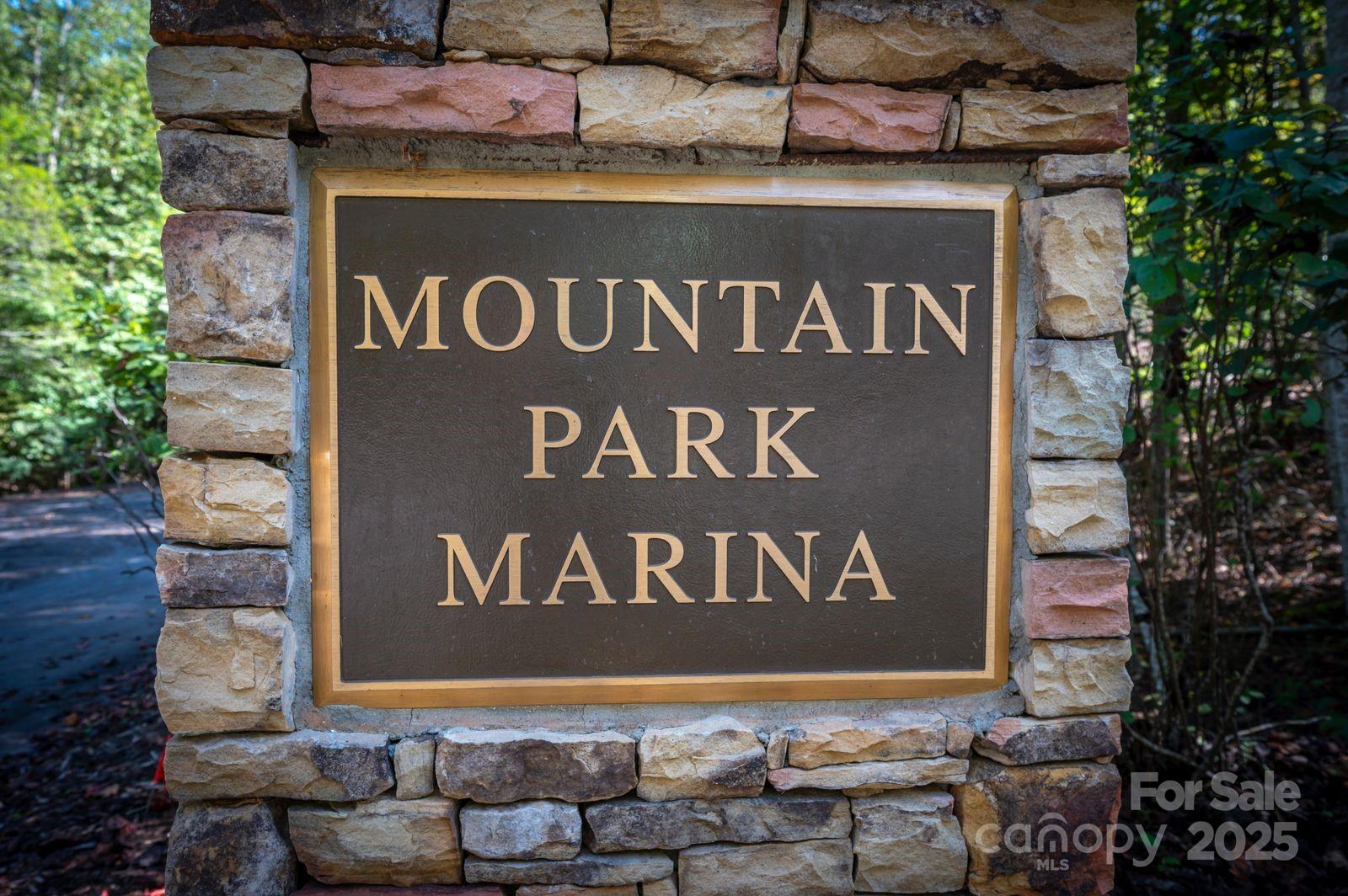 0 Mountain Parkway, Unit 29 Mill Spring, NC 28756 - Photo 13 of 15 a sign broad on the side of the road