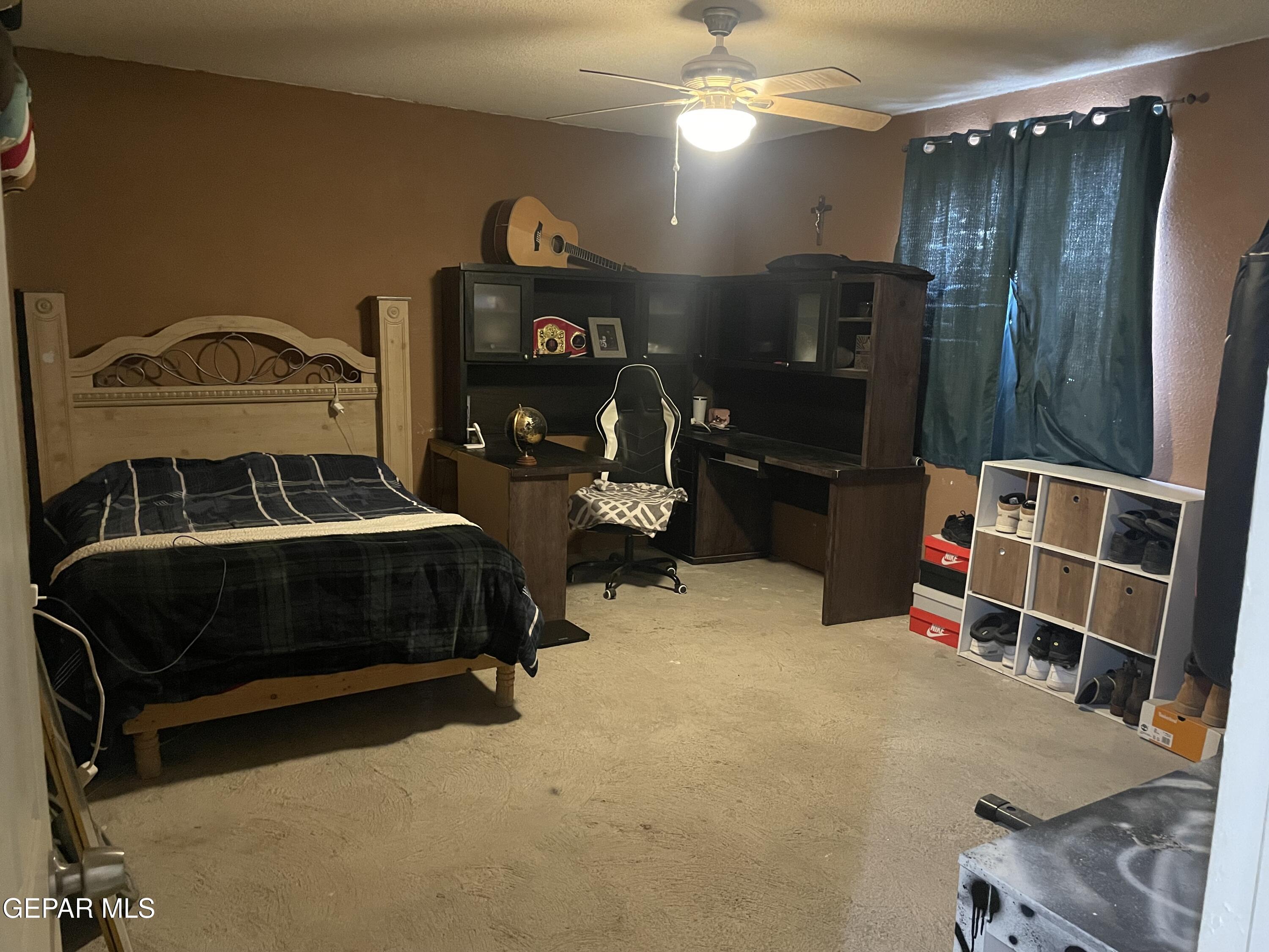 966 Traymore Road El Paso, TX 79928 - Photo 15 of 27 a bedroom with furniture and a mirror