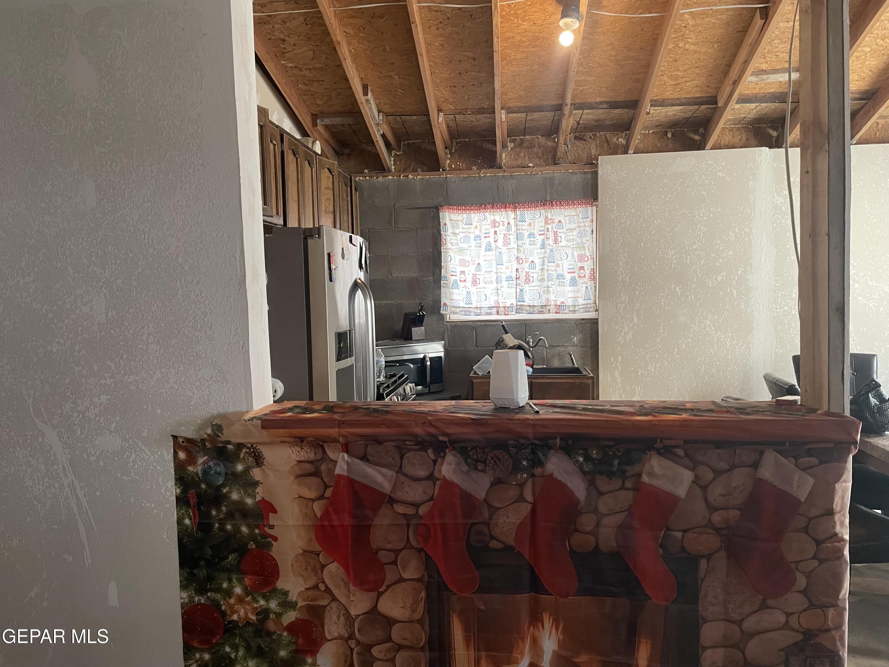 966 Traymore Road El Paso, TX 79928 - Photo 9 of 27 a bedroom with a bed and a dresser with wooden floor