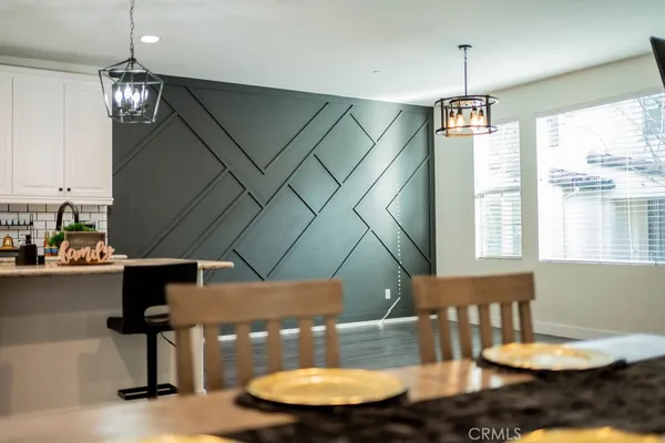 a very nice looking dining room with a table and chairs