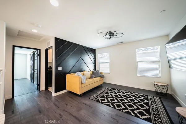 a bedroom with furniture and window