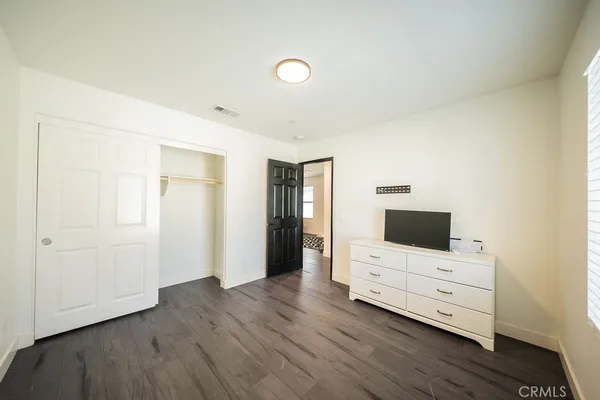 a view of room with wooden floor and window