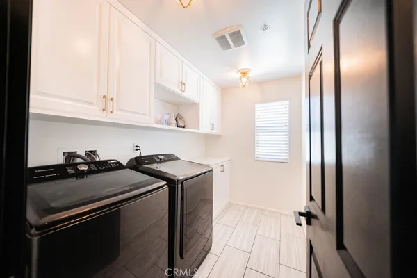a view of a kitchen with a sink and cabinets