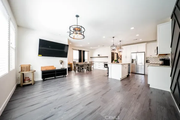 a view of living room with furniture and flat screen tv