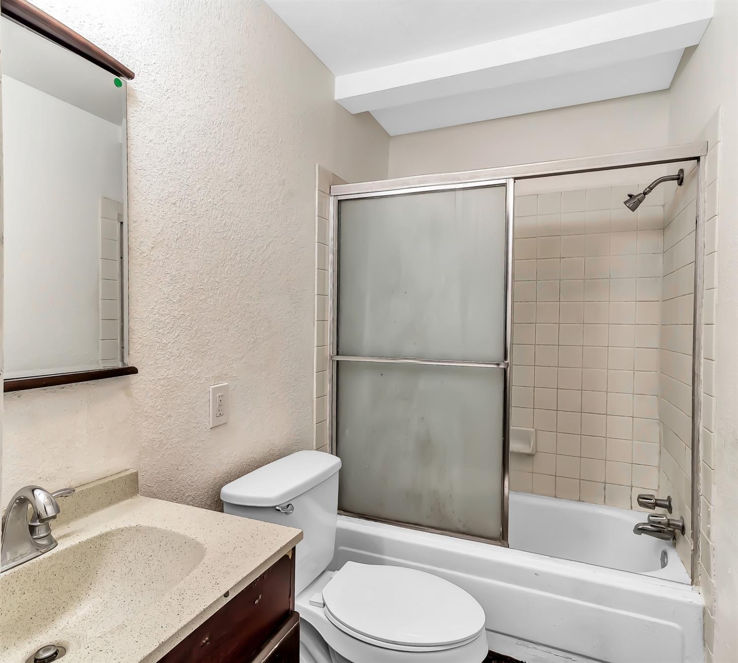 320 Acacia Street Lodi, CA 95240 - Photo 2 of 31 a bathroom with a sink toilet and shower