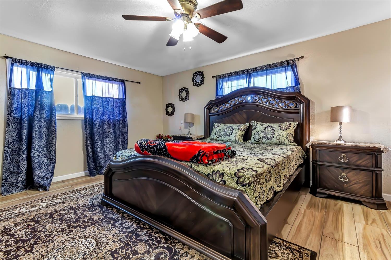 320 Acacia Street Lodi, CA 95240 - Photo 7 of 31 a bedroom with a bed and a window