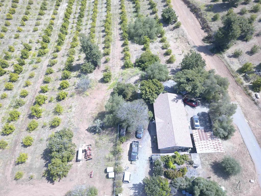 9153 West Lilac Road Escondido, CA 92026 - Photo 4 of 6 an aerial view of a house with a yard and garden